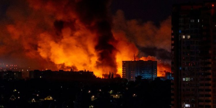 Ukraine says it struck a Russian air base as Moscow sent hundreds of drones into Kyiv